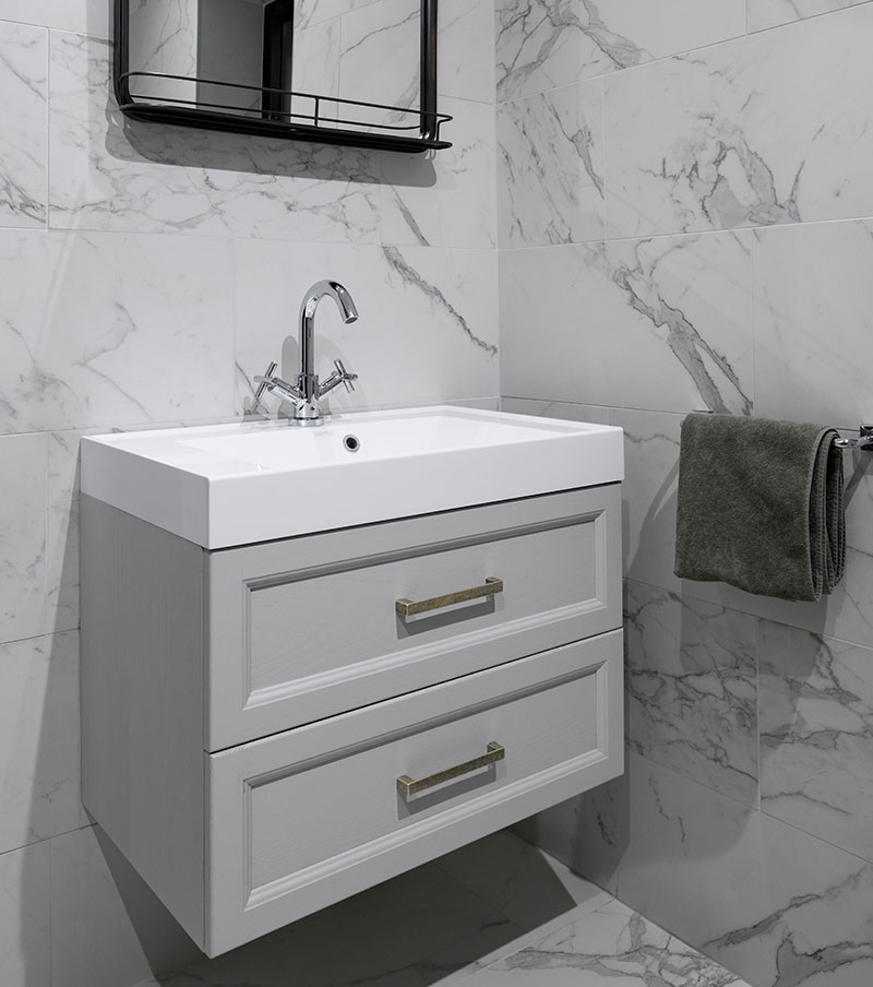 Bathroom and wet room design by Denise Long Marble effect wall tiles surrounding sink