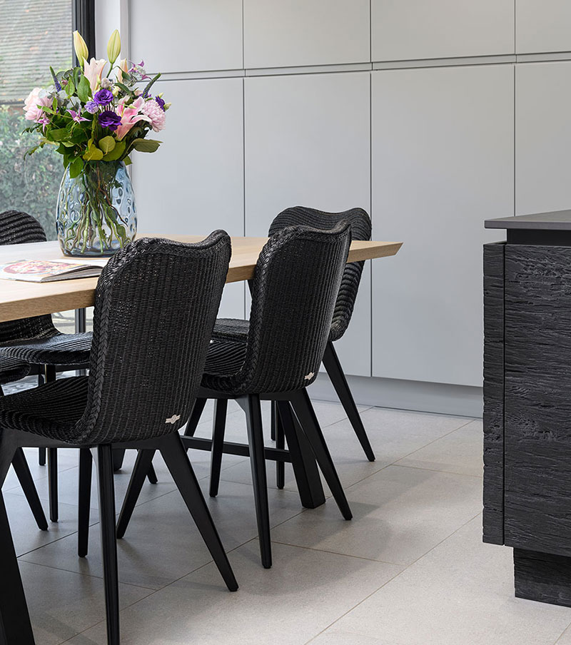 Dining area in kitchen with flowers on table