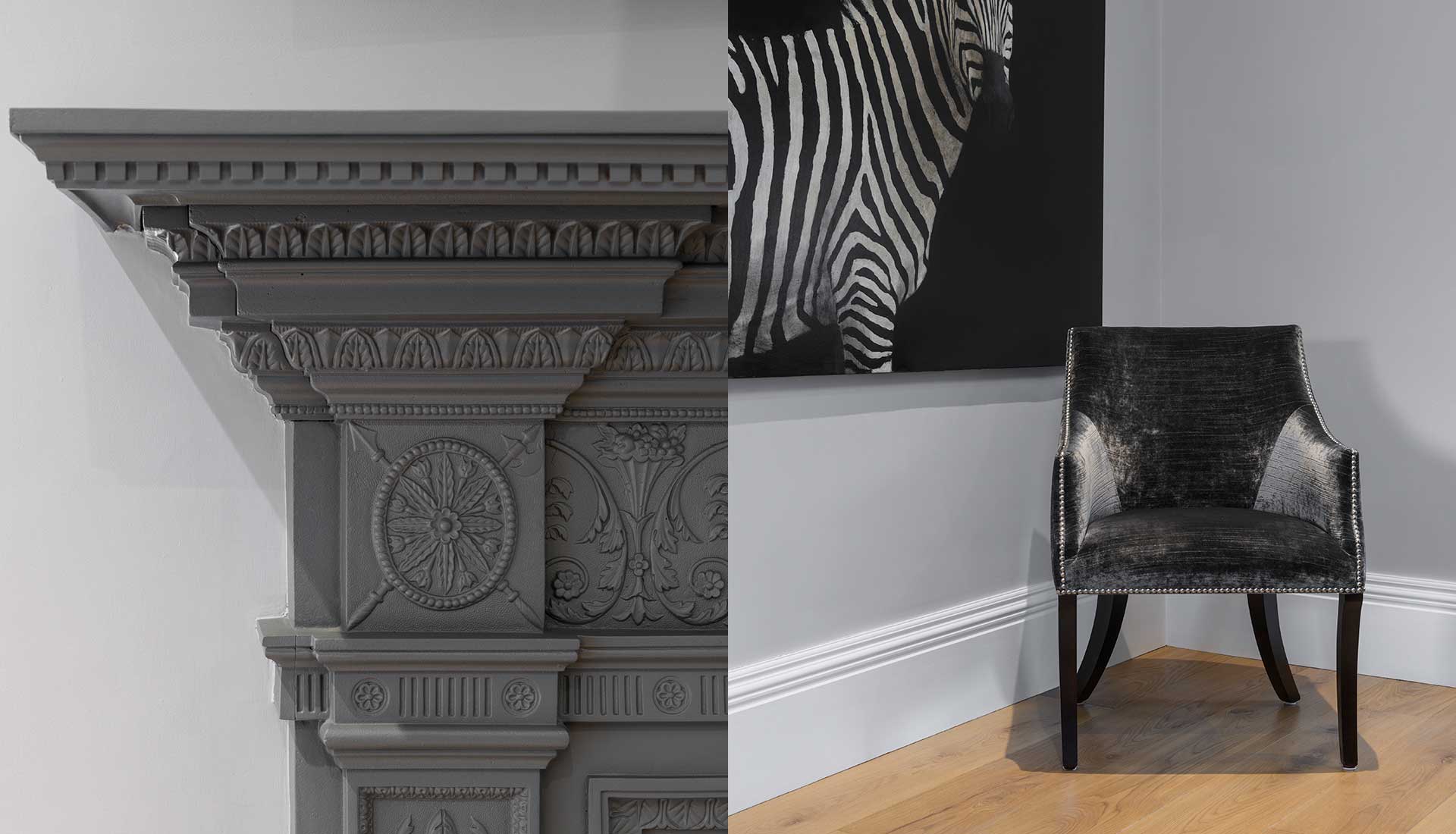 Fireplace detailing and chair with artwork above