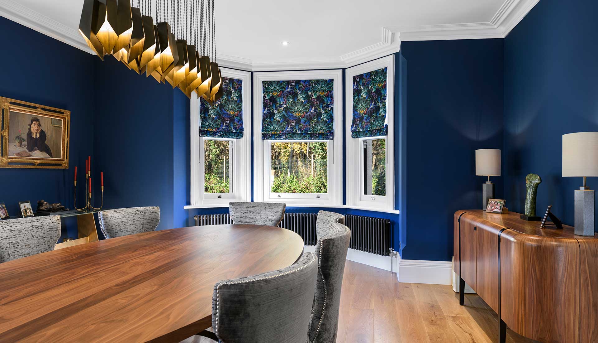 Pendant lighting above wooden dining table