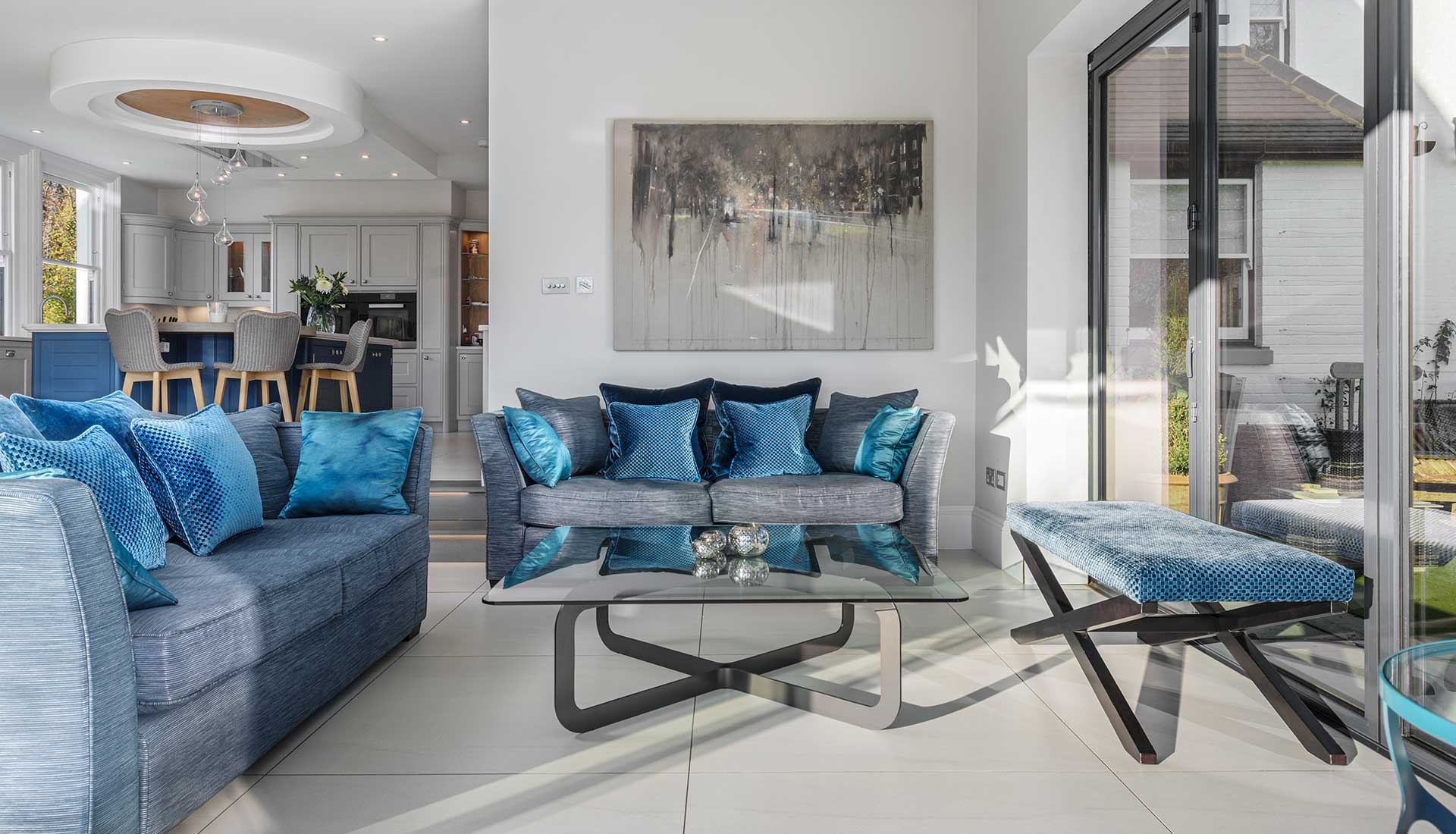 Berkshire House table in the middle of blue sofas