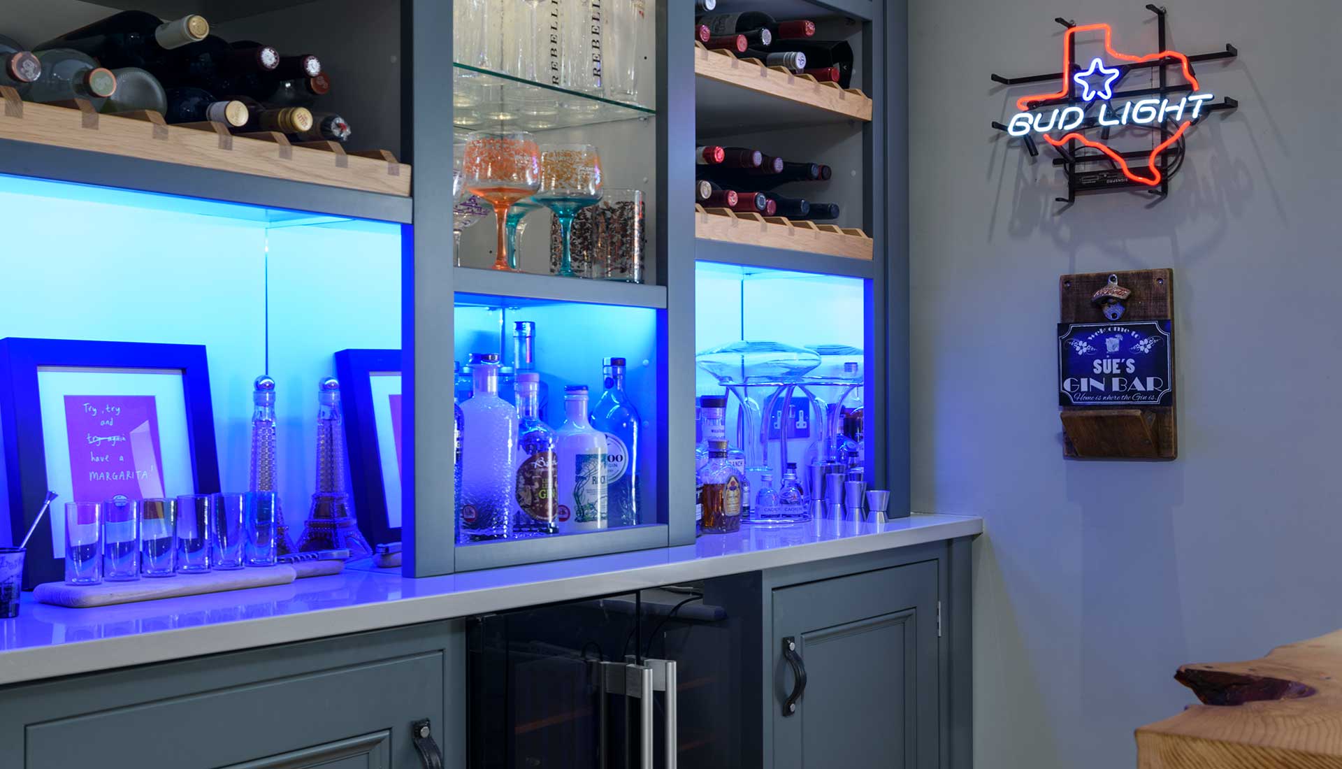 Drinks cabinet and neon light from bar area