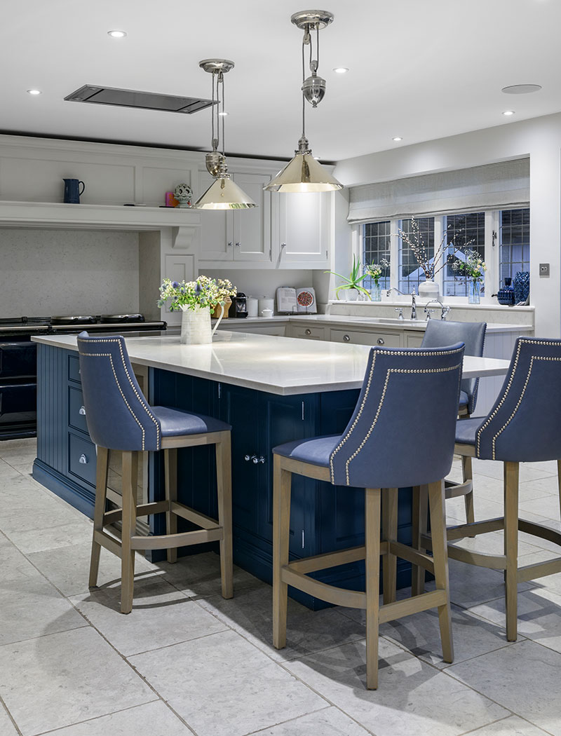 Dining area in kitchen with blue bar stools