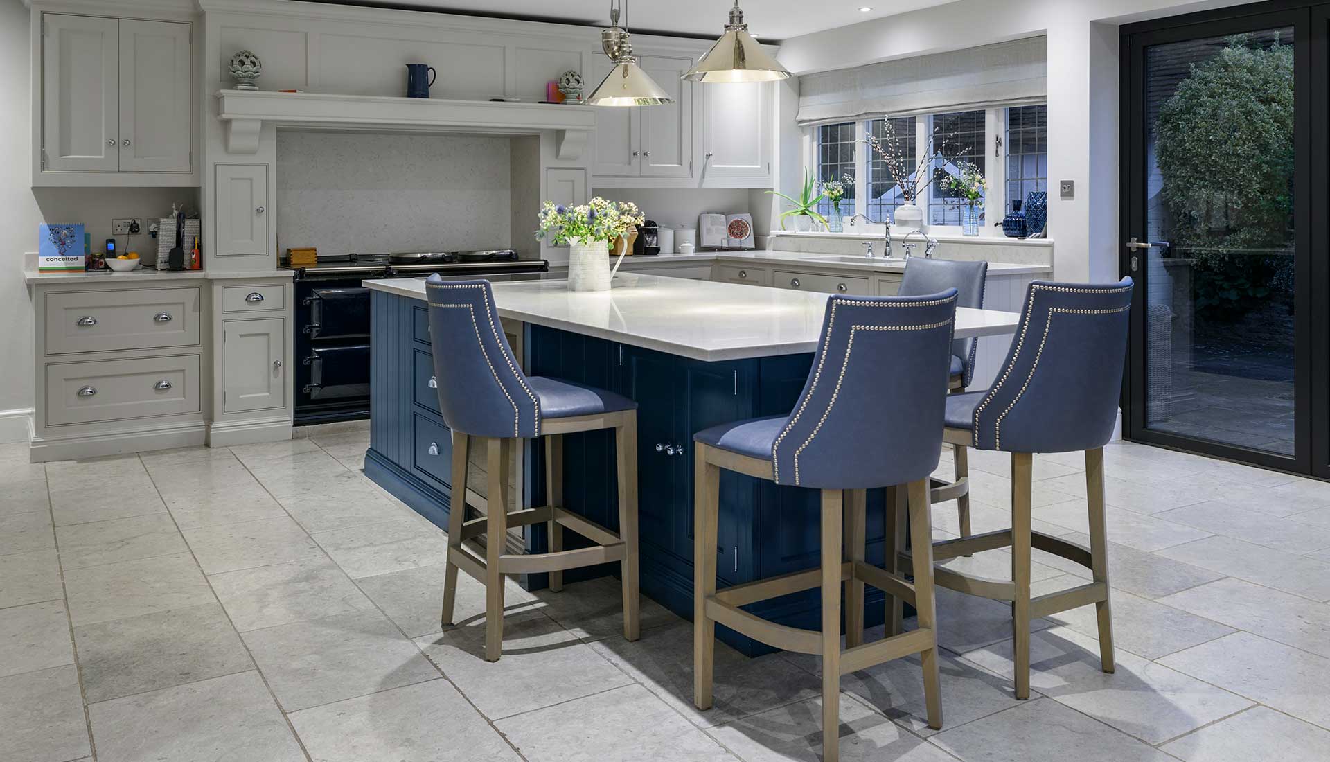Bar stools around marble in kitchen